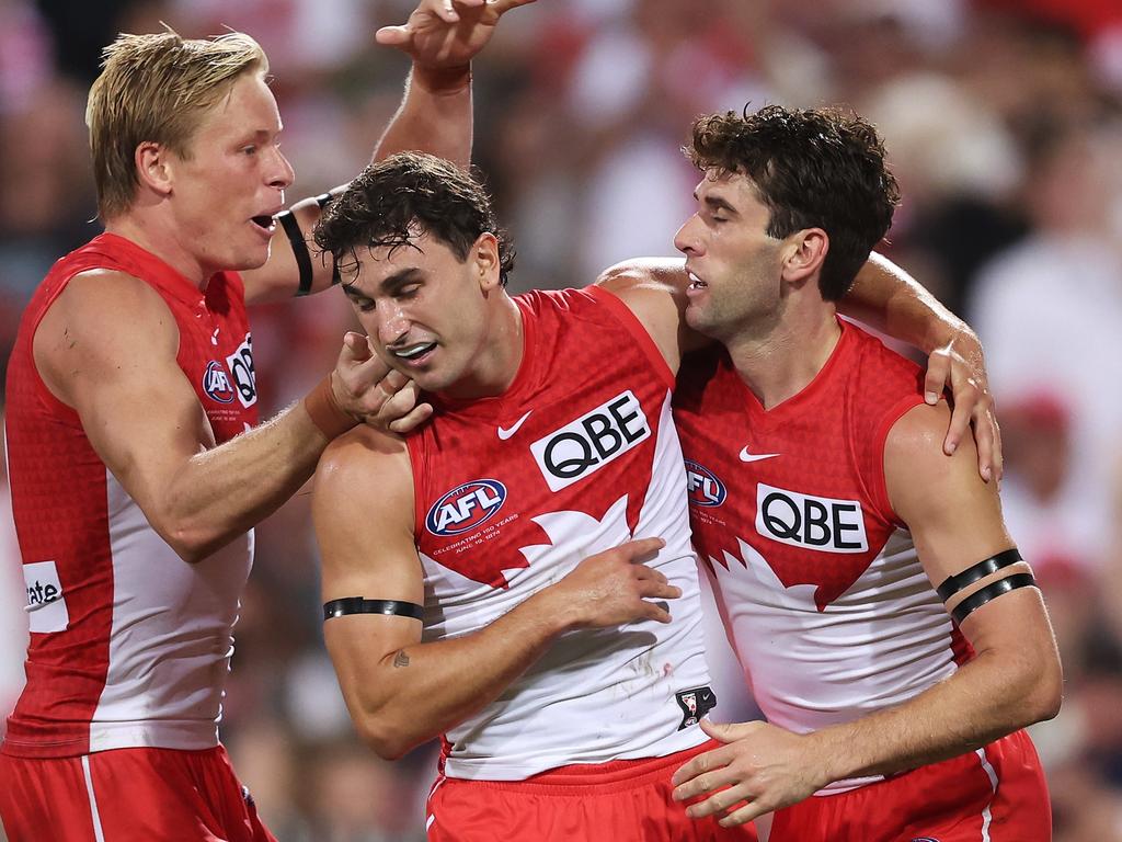 SYDNEY, AUSTRALIA - MARCH 07: Robbie Fox of the Swans celebrates with team mates after kicking a goal during the Opening Round AFL match between Sydney Swans and Melbourne Demons at SCG, on March 07, 2024, in Sydney, Australia. (Photo by Matt King/AFL Photos/Getty Images)