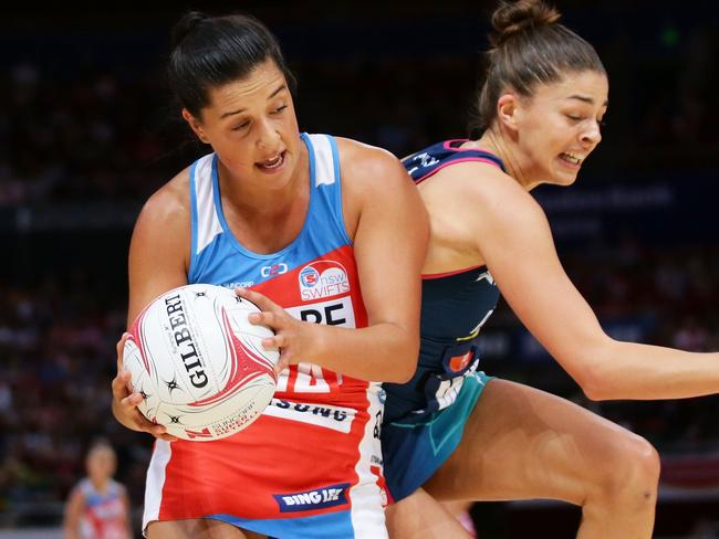 Swifts player Claire O'Brien is challenged by Chloe Watson in Super Netball last year.