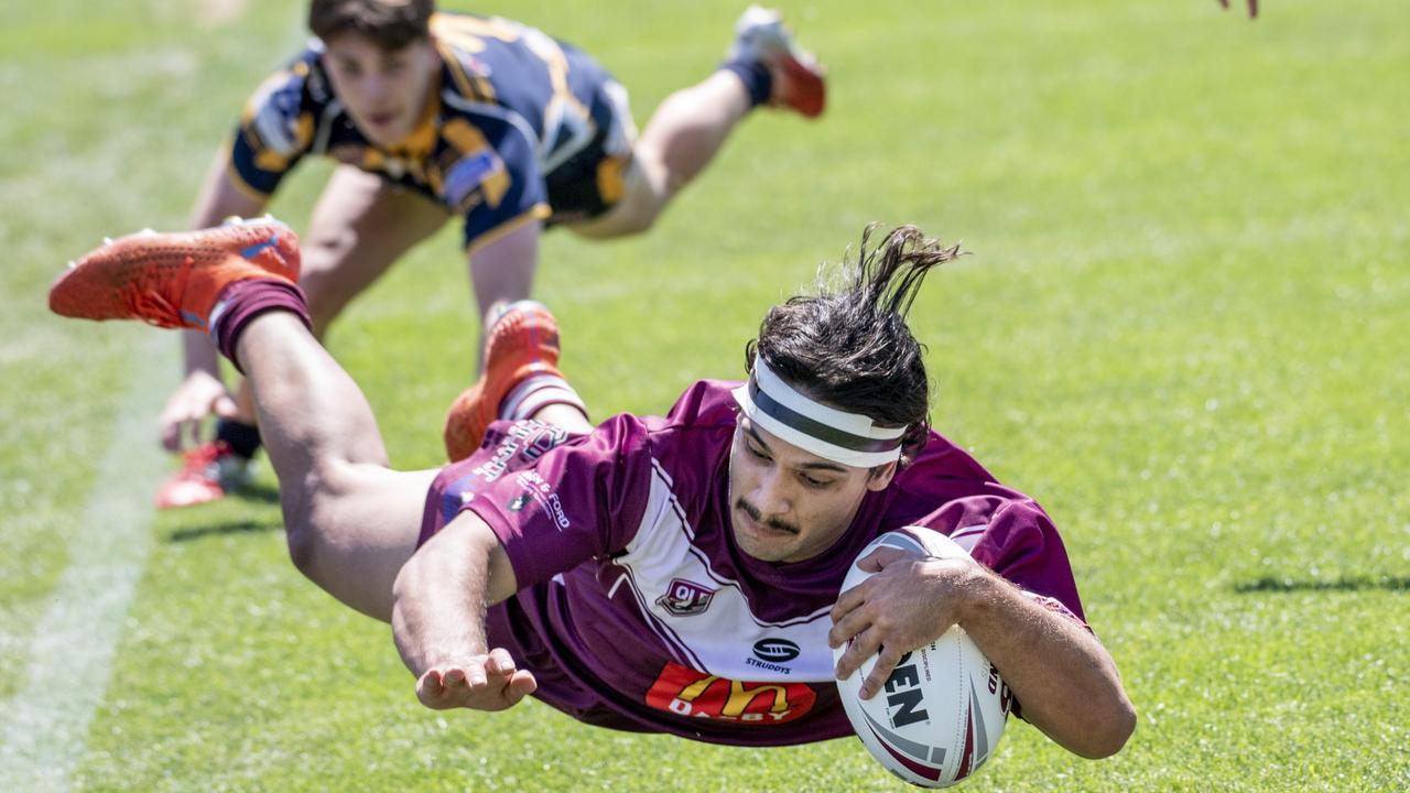 Highfields halfback Ryan Gill can only watch as Dalby's Keanu Wright-Dunrobin scores a try. Picture: Nev Madsen.