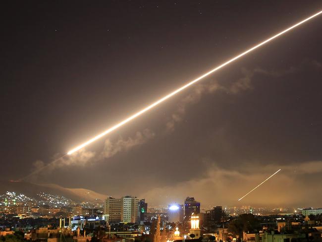 Damascus skies erupt with surface to air missile fire as the U.S. launches an attack on Syria. Picture: Hassan Ammar