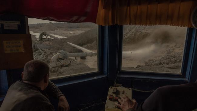 Workers operate machinery at an open-pit titanium mine in the Zhytomyr region, on Friday. Mr Zelensky and Mr Trump had been due to sign a minerals agreement. Picture: Roman Pilipey / AFP