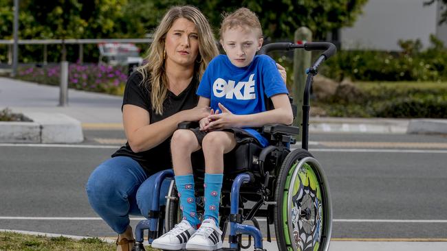 Samuel Amiet, 11, was left waiting for a taxi for hours at Coomera Westfield. His ride was repeatedly rejected. He’s pictured with his mother Simone Amiet. Picture: Jerad Williams