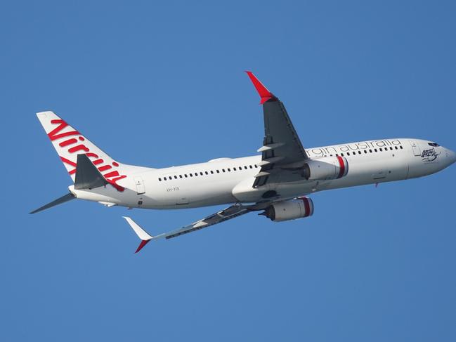 A Virgin Australia passenger jet plane takes off from Cairns Airport. PICTURE: BRENDAN RADKE