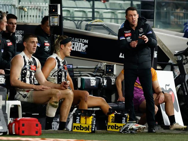 Darcy Moore and Craig McRae try to work out what’s going wrong on Friday night. Picture: Michael Willson/AFL Photos