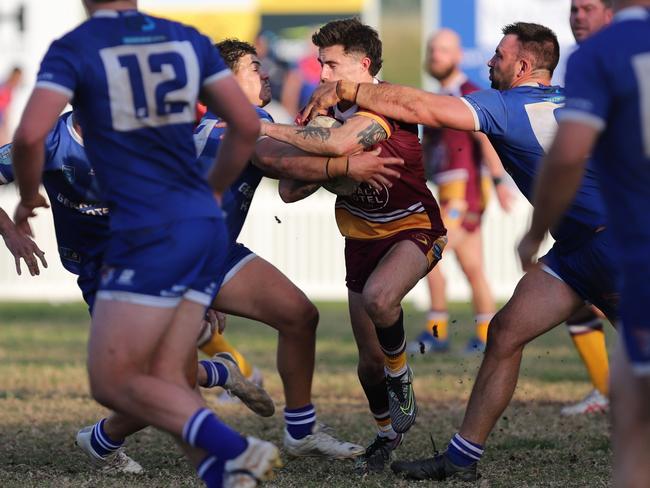 Braxton Wallace is wrapped up by the defence. Picture: Steve Montgomery/Ourfootyteam