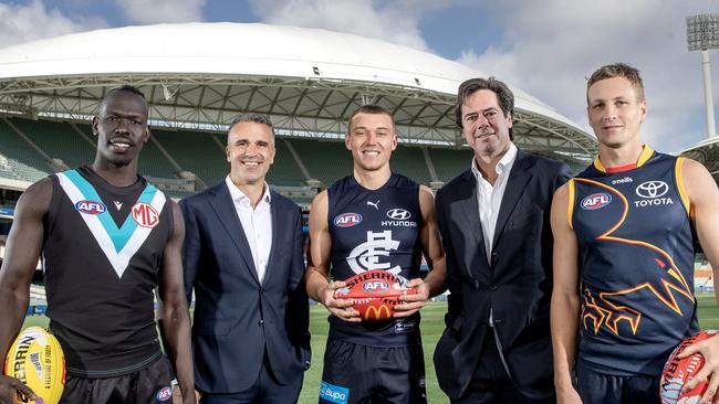 Gillon McLachlan, CEO of the AFL and the Premier of South Australia Peter Malinauskas stand with Aliir Aliir, Patrick Cripps of the Blues and Jordan Dawson of the Crows. Picture: Sarah Reed/AFL Photos via Getty Images