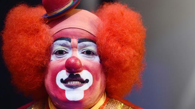 A clown pose during the second day of the XXI Convention of Clowns, at the Jimenez Rueda Theatre, in Mexico City on October 19, 2016. Latin American clowns hold their 21st annual conference in Mexico City from October 17 through 20. The ‘lurking clown’ phenomenon as a wave of hysteria about sightings of "creepy" or "killer" clowns that sweeps the United States and European nations concern those present. / AFP PHOTO / Alfredo ESTRELLA