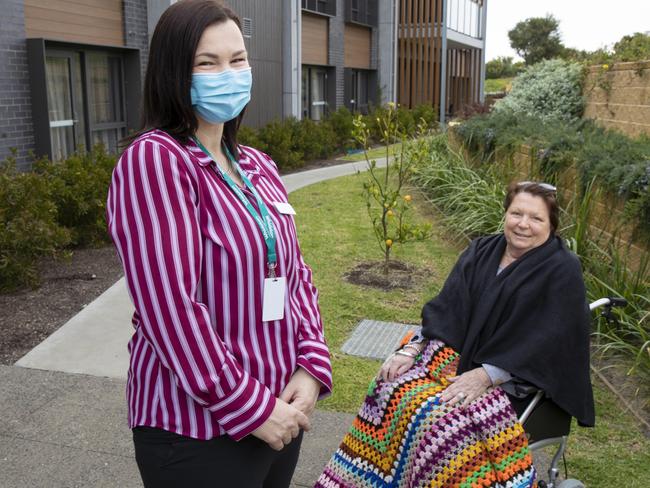 Lauren Smith, who used to be a GP's assistant doing mainly admin work before swtiching to a cliniical care co-ordintor role, with client Bev Wright. Picture: Peter Stoop