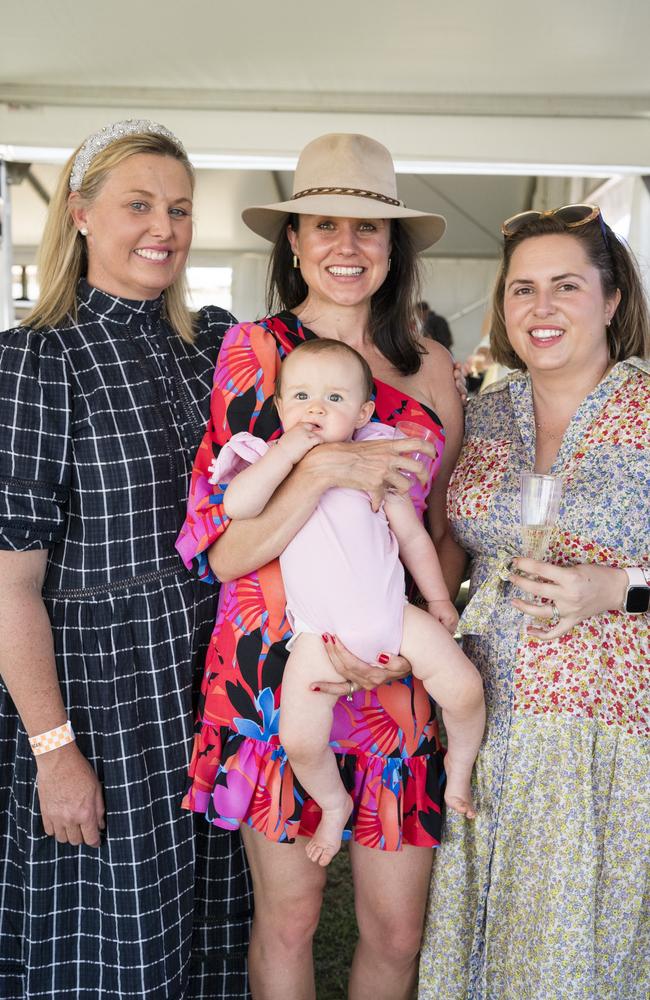 At the Clifton Races are (from left) Belinda Warby, Stevie McMurtie, holding her baby daughter Ella Johnson, and Sally Hughes, Saturday, October 28, 2023. Picture: Kevin Farmer