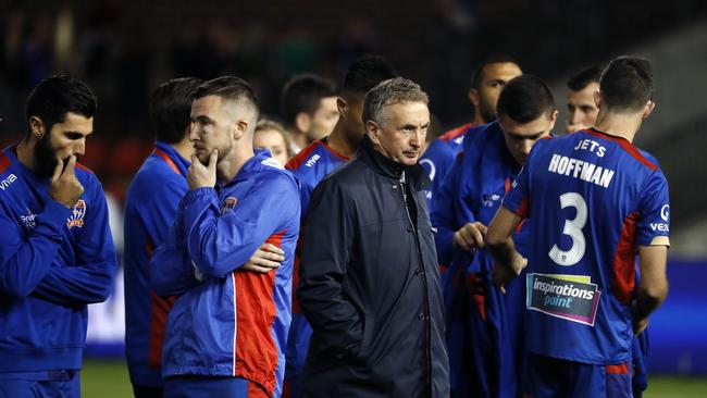 Newcastle Jets coach Ernie Merrick walks past his players after losing the 2018 A-League Grand Final