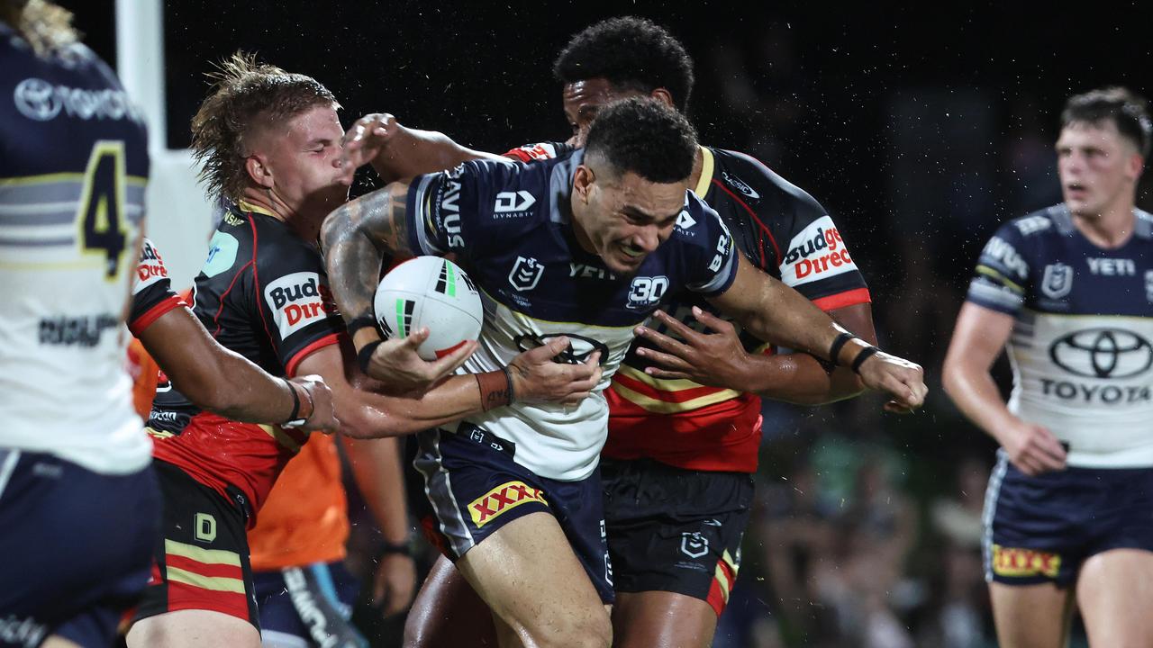 Cowboys' Robert Derby breaks through a tackle in the National Rugby League (NRL) pre season NRL match between the North Queensland Cowboys and the Dolphins, held at Barlow Park. Picture: Brendan Radke