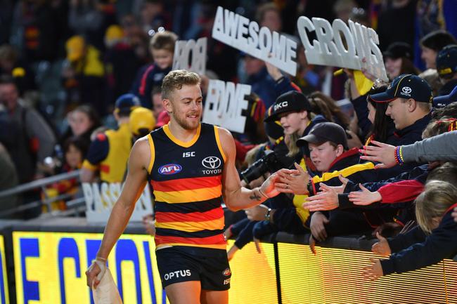 Crows Hugh Greenwood slaps hands with the crowd after the Round 7 victory over the Fremantle Dockers at the Adelaide Oval. Picture: David Mariuz/AAP