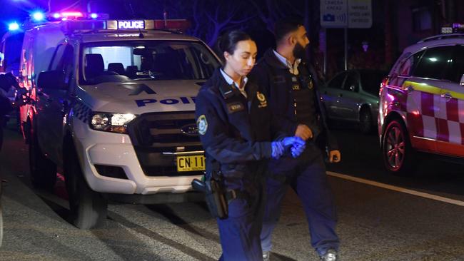 Police at the scene after the stabbing. Picture: Gordon McComiskie