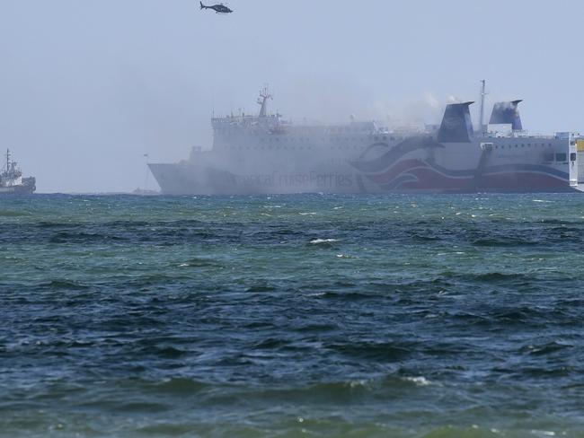 Smoke billows from the Caribbean Fantasy off the coast of San Juan, Puerto Rico. Picture: AP Photo/Carlos Giusti