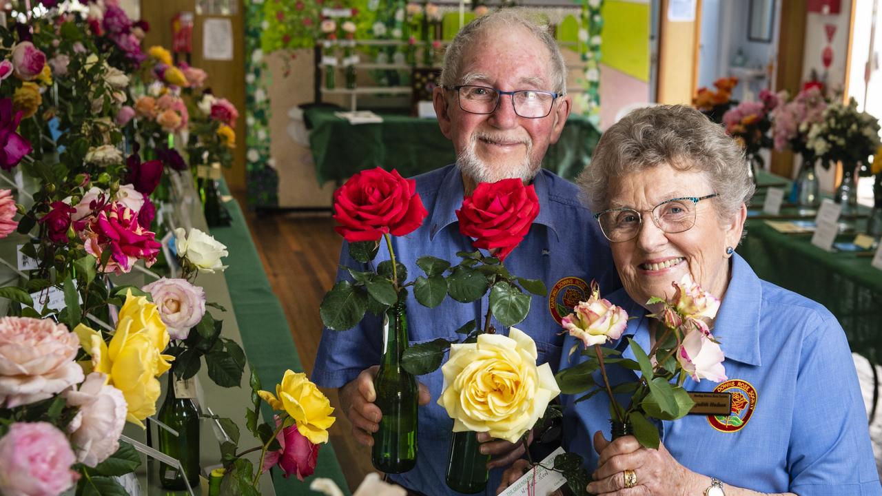 Queensland Rose Society Darling Downs members Doug and Judith Hudson with their roses in the 2022 Spring Champion Rose Show at the Rose Cottage in the Queensland State Rose Garden, Saturday, October 8, 2022. Picture: Kevin Farmer