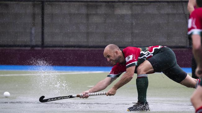 Redcliffe’s Damien Budd takes some water with him. Picture: Renae Droop