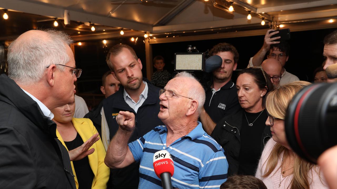 A man took Scott Morrison to task over iCare as the Prime Minister visited the Edgeworth Tavern in Newcastle. Picture: Damian Shaw