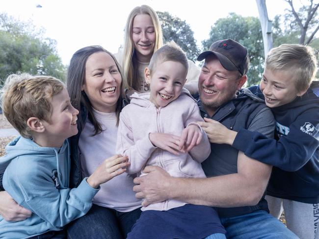 July 2, 2024: 7 year old Holly Zerk with her family, Mum Lee-Anne McCracken, Dad Travis Zerk and siblings Jameson 10, Tahlia 13 and Mason 12. Holly was diagnosed with neuroblastoma last year. Picture: Kelly Barnes
