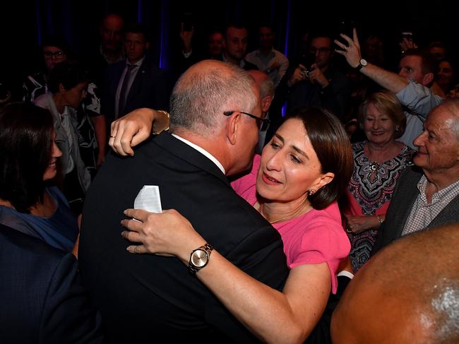Prime Minister Scott Morrison embraces Ms Berejiklian after her election victory on Saturday. Picture: AAP 