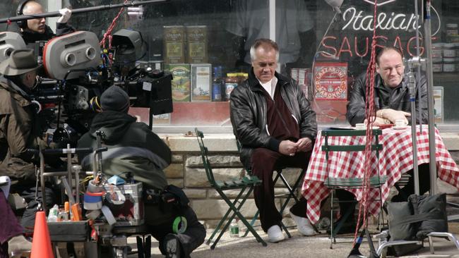 Tony Sirico, left, as Paulie Walnuts and James Gandolfini, right, as Tony Soprano outside the fictional Satriale's pork store in Kearny, New Jersey, 2007, filming one of the last episodes of The Sopranos. Picture: AP/Mike Derer.