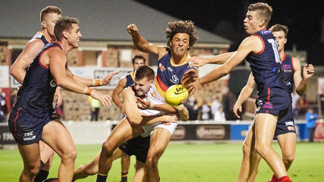 Adelaide's Ben Davis tackled by Mac Bower. Picture: Matt Loxton/(AAP