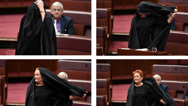 Hanson takes off a burqa during Senate Question Time in a controversial stunt that was widely condemned.