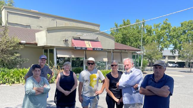 Violet St, Bendigo residents are opposing a developer's plan to build a new Guzman y Gomez next to their homes. Left to right: Jennifer Campbell, Tim Jenkyn, Cindy Smith, Chris Corr, Heather Rohde, Michael Rohde, Colin Campbell. Picture: Gianni Francis.