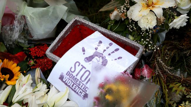 The public leave flowers at the vigil for Hannah Clarke and her three children Aaliyah, 6, Laianah, 4, and Trey, 3, at Bill Hewitt Reserve in Brisbane, Sunday February 23, 2020. (AAP Image/Sarah Marshall)