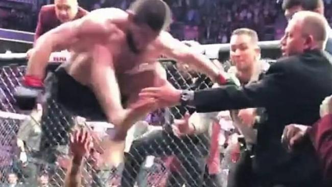 Khabib Nurmagomedov leaps into the crowd at the end of the bout.