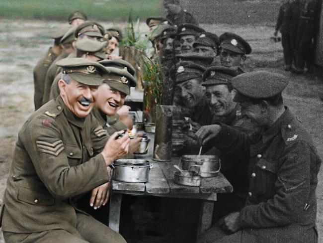 This image of officers eating their rations shows the difference between the restored and original footage used in the They Shall Not Grow Old.