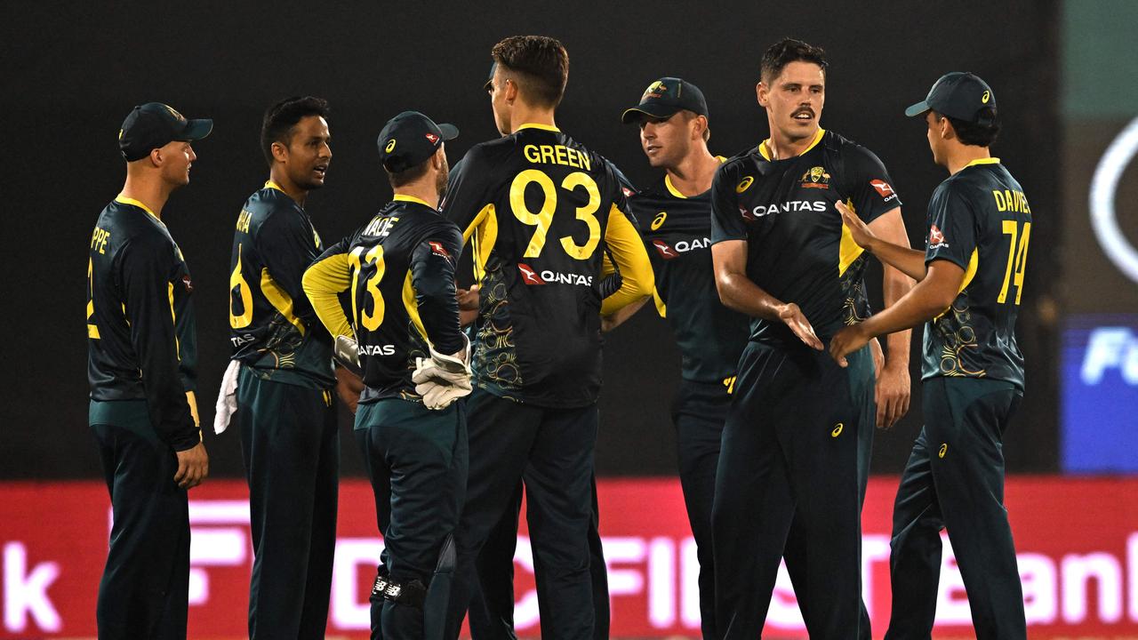 Australia's players celebrate after the dismissal of India's Axar Patel. (Photo by INDRANIL MUKHERJEE / AFP)