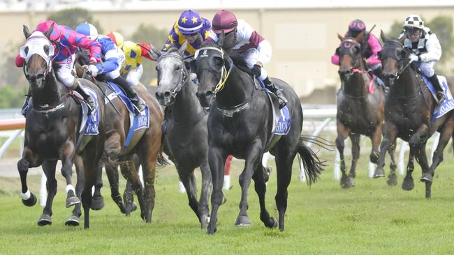 Kick ‘n’ Tel (purple cap with yellow stars) finished second behind Saipan in her last run at the Gold Coast. Picture: Jessica Hawkins. Trackside Photography.