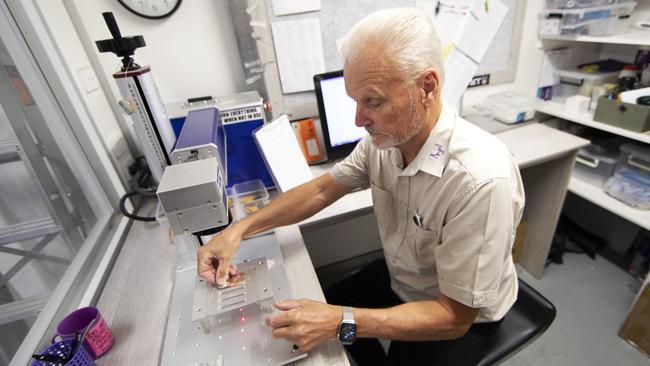 Tom Jorgensen works with the laser. Picture: NIGEL HALLETT