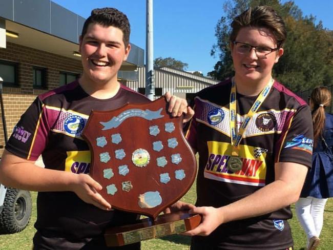 Hills Bulls front rowers Jake Leyshon, left, and Jackson Fletcher, with the trophy.