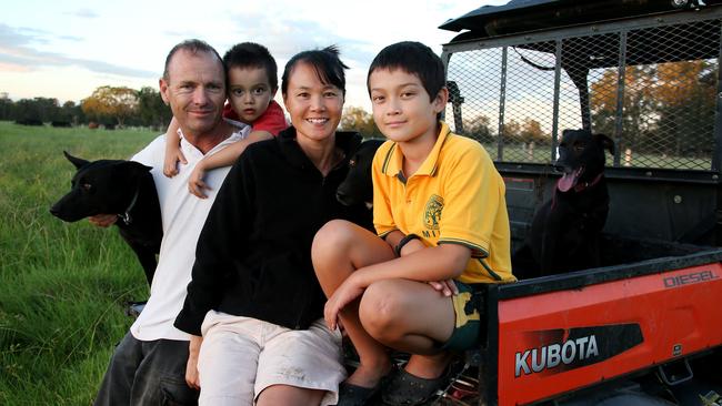 Farmer Darren Croker with his wife Rosanne and kids Jack, 9, and Tom, 2 on their property at Oxley Island. Picture: Nathan Edwards