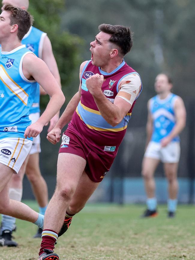 Lachlan Rush celebrates a goal for Marcellin in the VAFA. Picture: George Salpigtidis