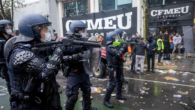 Victorian police try to restore peace outside the CFMEU headquarters in Melbourne’s CBD on Monday. Picture: David Geraghty