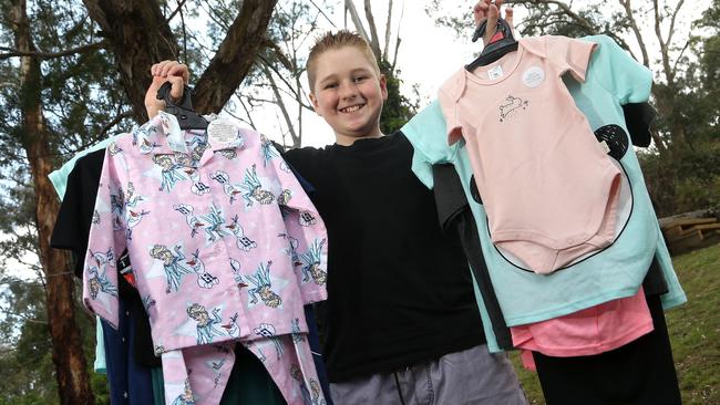 Sam Morrison holding pyjamas donated by the generous community. Picture: Hamish Blair