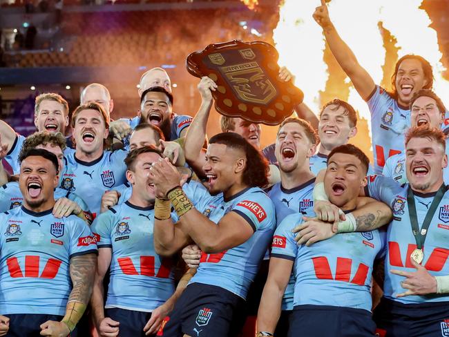 The NSW Blues celebrate after winning game 3 of the State of Origin at Suncorp Stadium. Picture by Luke Marsden.