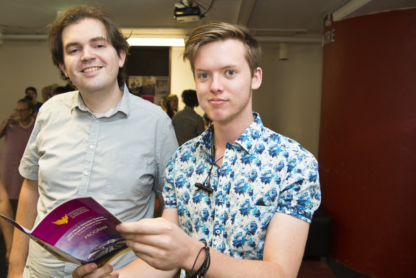 USQ Film and Television student Robert Morgan (left) and Dominic Auer look over the program for the 2019 showcase at USQ Arts Theatre, Friday, November 8, 2019. Picture: Kevin Farmer