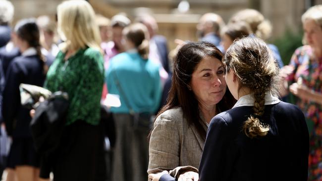 A woman breaks down outside the service. Picture: NCA NewsWire/ Dylan Robinson