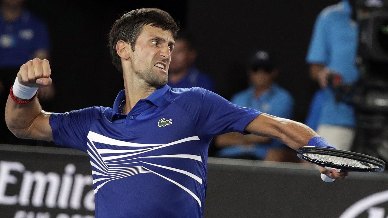 Serbia's Novak Djokovic celebrates after winning a point against Mitchell Krueger.