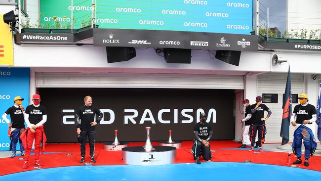 Mercedes' British driver Lewis Hamilton, centre, kneels during the opening ceremony ahead of the Formula One Hungarian Grand Prix. Picture: AFP