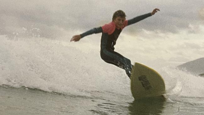 Young Simon surfing.