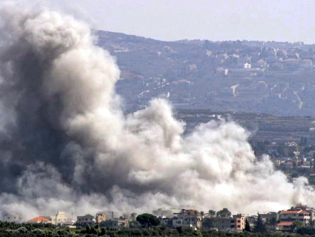 A cloud of smoke erupts following an Israeli air strike on the village of Deir Qanoun on October 14, 2024. Picture: AFP