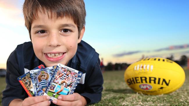 Andrew O'Donnell with his footy cards. picture: Glenn Ferguson