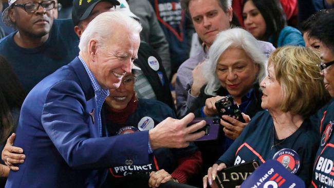 Joe Biden takes a selfie with supporter Margarita Rebollal after speaking at a Nevada Caucus watch party in February. Picture: AFP