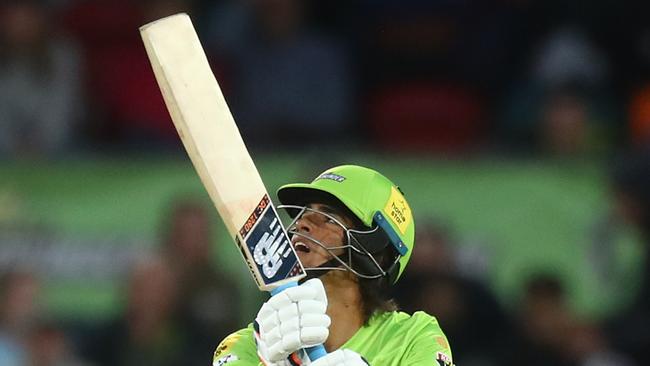 CANBERRA, AUSTRALIA - DECEMBER 29: Ollie Davies of the Thunder hits out during the Big Bash League match between Sydney Thunder and the Melbourne Stars at Manuka Oval, on December 29, 2020, in Canberra, Australia. (Photo by Mike Owen/Getty Images)