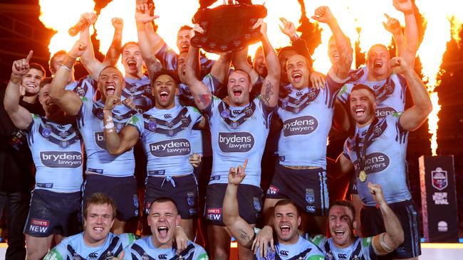 SYDNEY, AUSTRALIA – JULY 10: Boyd Cordner of the Blues and teammates celebrate with the State of Origin trophy after winning the series and winning game three of the 2019 State of Origin series between the New South Wales Blues and the Queensland Maroons at ANZ Stadium on July 10, 2019 in Sydney, Australia. (Photo by Cameron Spencer/Getty Images)