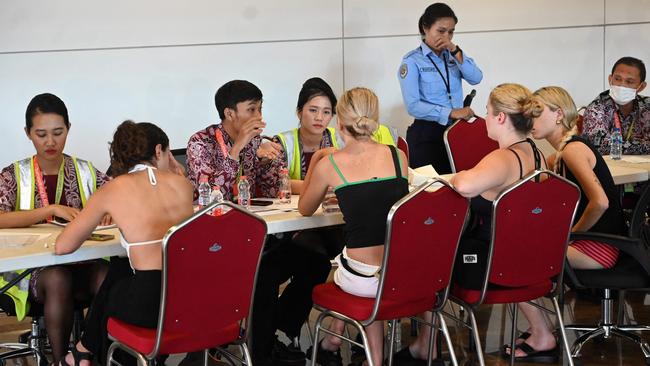 Australians co-ordinate with airport officials after eruptions from Mount Lewotobi Laki-Laki led to mass flight cancellations across Bali. Picture: AFP